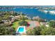 Aerial view of Oak Harbour featuring a swimming pool, tennis courts, and a serene lake at 487 Oak Haven Dr # 487, Altamonte Springs, FL 32701
