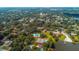 Aerial view of lush neighborhood with a community pool, tennis courts, and lake access at 487 Oak Haven Dr # 487, Altamonte Springs, FL 32701
