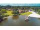 Aerial view of lakeside homes with boat ramp and dock, blending community living with waterfront charm at 487 Oak Haven Dr # 487, Altamonte Springs, FL 32701