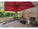 Brick patio with a grill, outdoor seating, a brick exterior, and a red umbrella at 487 Oak Haven Dr # 487, Altamonte Springs, FL 32701