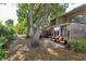 Spacious backyard featuring patio seating, mature trees, and well-maintained landscaping at 487 Oak Haven Dr # 487, Altamonte Springs, FL 32701