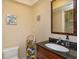 Bathroom featuring a vanity with dark countertop and a decorative mirror at 487 Oak Haven Dr # 487, Altamonte Springs, FL 32701