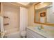 Bathroom featuring tile, bathtub with shower, updated sink, and gold fixtures at 487 Oak Haven Dr # 487, Altamonte Springs, FL 32701