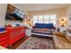 Cozy bedroom with day bed, shutters, and a comfortable chair at 487 Oak Haven Dr # 487, Altamonte Springs, FL 32701