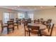Community common area with round wooden tables and comfortable seating near bright windows at 487 Oak Haven Dr # 487, Altamonte Springs, FL 32701