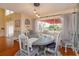Charming dining room with natural light, stylish furnishings, and backyard views at 487 Oak Haven Dr # 487, Altamonte Springs, FL 32701