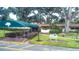 Inviting Harbour Club entrance with lush greenery, well-maintained landscaping, and covered walkway at 487 Oak Haven Dr # 487, Altamonte Springs, FL 32701