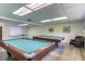 Well-lit game room featuring two pool tables, a ping pong table, and comfortable seating at 487 Oak Haven Dr # 487, Altamonte Springs, FL 32701