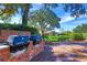 Community outdoor grilling area featuring brick structures, charcoal grills, and well-kept grounds at 487 Oak Haven Dr # 487, Altamonte Springs, FL 32701