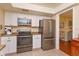 Clean kitchen with stainless steel appliances, white cabinets, and tile flooring at 487 Oak Haven Dr # 487, Altamonte Springs, FL 32701