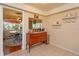 View of dining room from the kitchen with display shelving and wooden cabinet at 487 Oak Haven Dr # 487, Altamonte Springs, FL 32701