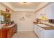 Cozy kitchen with wood cabinet and display shelving adds charm at 487 Oak Haven Dr # 487, Altamonte Springs, FL 32701