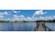 Scenic lake view featuring a community pier and clubhouse, perfect for relaxation and recreation at 487 Oak Haven Dr # 487, Altamonte Springs, FL 32701