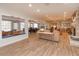 Bright common room with a brick fireplace, ample seating, and views of the verdant outdoors at 487 Oak Haven Dr # 487, Altamonte Springs, FL 32701