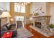 Bright living room boasting high ceilings, a stone fireplace, and abundant natural light at 487 Oak Haven Dr # 487, Altamonte Springs, FL 32701