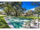 Community shuffleboard court with multiple lanes and benches surrounded by mature trees on a sunny day at 487 Oak Haven Dr # 487, Altamonte Springs, FL 32701