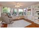 Relaxing sun room with large windows, a massage chair, and hardwood flooring at 487 Oak Haven Dr # 487, Altamonte Springs, FL 32701