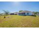 A spacious backyard features a screened patio and a fenced perimeter, offering privacy and space for outdoor enjoyment at 104 Birmingham Dr, Kissimmee, FL 34758