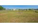 Spacious backyard featuring lush grass, a chain-link fence, and plenty of room to relax and play at 104 Birmingham Dr, Kissimmee, FL 34758