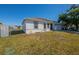 Well-kept one-story home with green lawn space and a two-car garage at 104 Birmingham Dr, Kissimmee, FL 34758