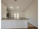 Bright kitchen featuring granite countertops, stainless steel appliances, and sliding glass doors to the backyard at 104 Birmingham Dr, Kissimmee, FL 34758