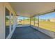 Screened-in lanai overlooking the grassy yard at 104 Birmingham Dr, Kissimmee, FL 34758