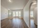 Inviting living area features a bay window, new flooring, and ample natural light at 104 Birmingham Dr, Kissimmee, FL 34758
