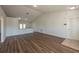 Bright living room features a view to the kitchen, new floors, and recessed lighting at 104 Birmingham Dr, Kissimmee, FL 34758