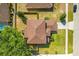 An aerial view shows the roof shape and orientation to the lot lines at 10820 Wyandotte Dr, Clermont, FL 34711