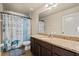 Bathroom featuring a vanity, a sink, a toilet, a shower-tub combination, and a mirror at 10820 Wyandotte Dr, Clermont, FL 34711