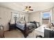 Bedroom featuring a cozy bed and desk setup at 10820 Wyandotte Dr, Clermont, FL 34711