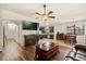An open-concept features a fireplace, television, and dining room at 10820 Wyandotte Dr, Clermont, FL 34711