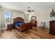 The main bedroom features wood-look floors, neutral walls, ceiling fan, and natural lighting at 10820 Wyandotte Dr, Clermont, FL 34711
