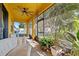 Relaxing screened-in patio featuring comfortable seating and view to the backyard at 10820 Wyandotte Dr, Clermont, FL 34711