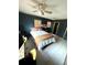 Comfortable bedroom featuring a ceiling fan and tiled floors, complete with a spacious closet at 1098 Henry Balch Dr, Orlando, FL 32810