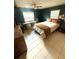 Comfortable bedroom featuring a ceiling fan and dedicated desk area, ideal for work or study at 1098 Henry Balch Dr, Orlando, FL 32810