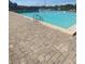 Inviting community pool with brick paved deck great for relaxing and swimming at 1098 Henry Balch Dr, Orlando, FL 32810