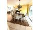 Dining room features a decorative chandelier and neutral colors with a sliding glass door for natural light at 1098 Henry Balch Dr, Orlando, FL 32810