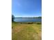 Serene lake view surrounded by lush greenery, offering a tranquil retreat at 1098 Henry Balch Dr, Orlando, FL 32810