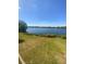 Serene lake view surrounded by lush greenery, offering a tranquil retreat at 1098 Henry Balch Dr, Orlando, FL 32810
