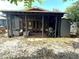 Cozy covered patio with outdoor seating and a grill, perfect for relaxing and entertaining at 1098 Henry Balch Dr, Orlando, FL 32810