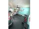 Spacious workout room equipped with exercise equipment, soft lighting, and ceiling fans at 1098 Henry Balch Dr, Orlando, FL 32810