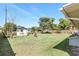 The home's backyard includes a storage shed and mature landscaping at 1109 Beatrice Dr, Orlando, FL 32810