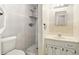 Cozy bathroom with tiled walls, a shower, and a vanity with storage at 1109 Beatrice Dr, Orlando, FL 32810