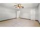 Bedroom with tiled floors, neutral walls, ceiling fan, and a closet for storage at 1109 Beatrice Dr, Orlando, FL 32810