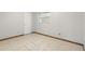 Simple bedroom with tiled flooring, neutral walls, and a window for natural light at 1109 Beatrice Dr, Orlando, FL 32810
