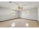 Well-lit bedroom features tiled floors, neutral walls, and a ceiling fan for comfort at 1109 Beatrice Dr, Orlando, FL 32810