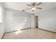 Bedroom featuring tiled floors, neutral walls, ceiling fan, and ample natural light at 1109 Beatrice Dr, Orlando, FL 32810