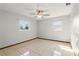 Bedroom with tiled floors, neutral walls, and windows for natural light and air flow at 1109 Beatrice Dr, Orlando, FL 32810