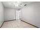 Bedroom with tiled floors, neutral walls, and a ceiling fan for added comfort at 1109 Beatrice Dr, Orlando, FL 32810